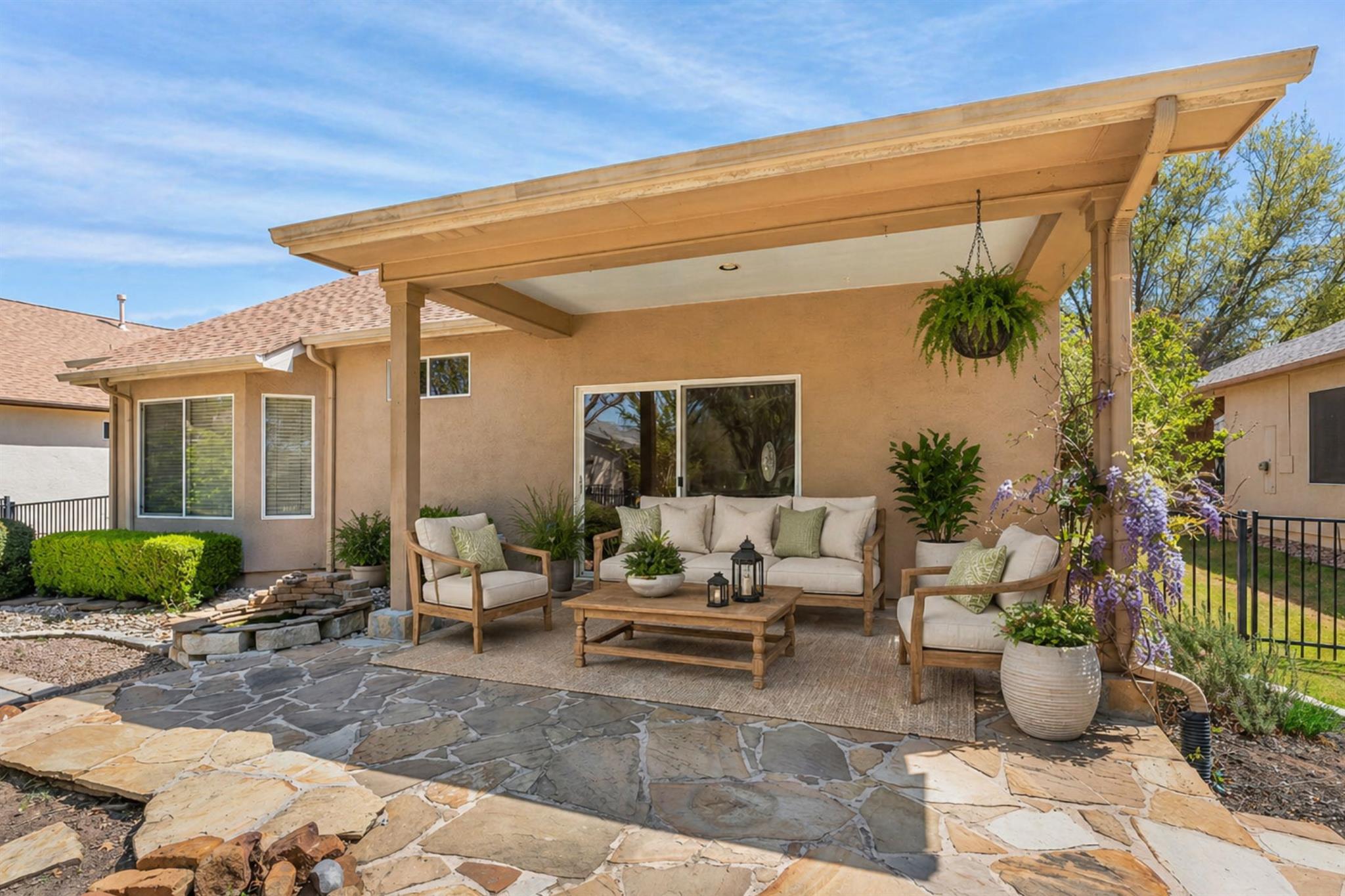 Covered patio featuring a flagstone surface, stuc