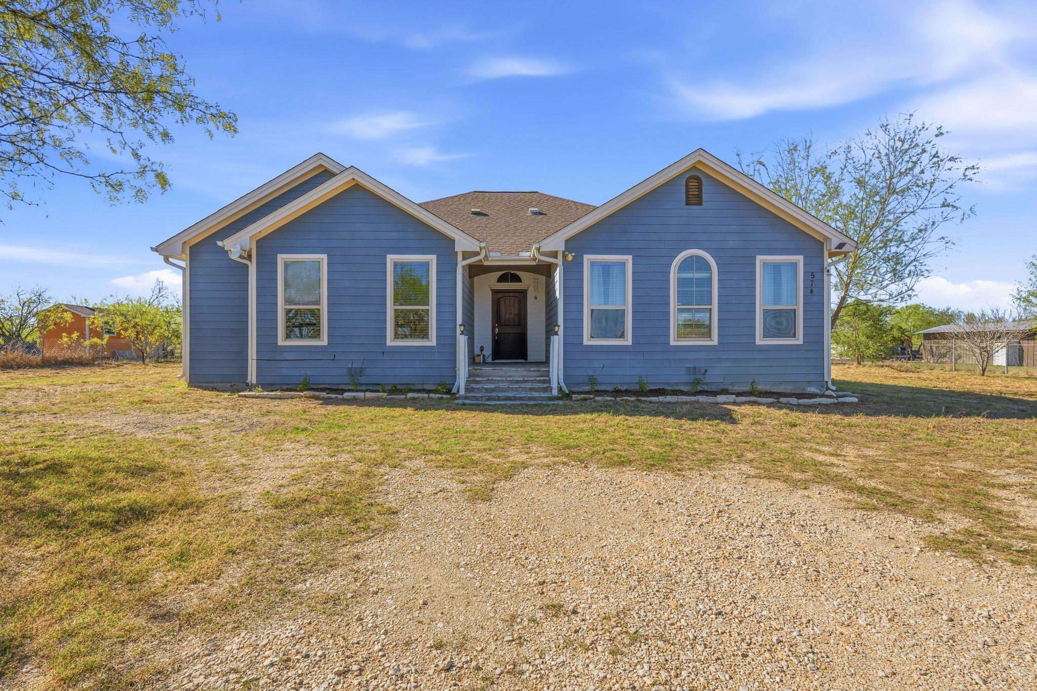 View of front of house featuring a front lawn