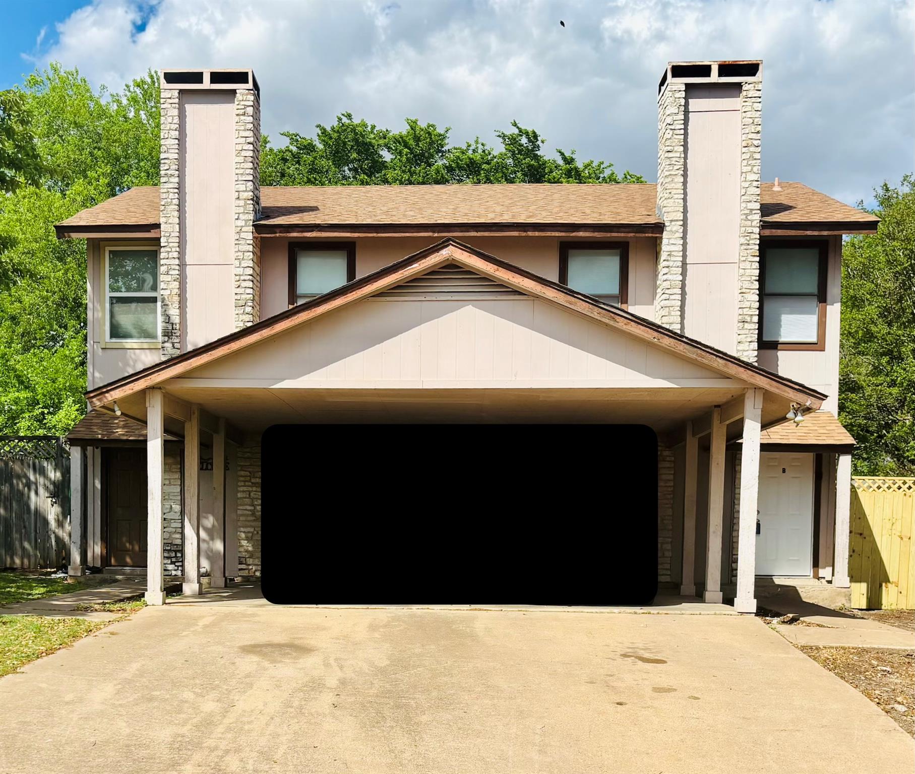 View of front of house with a chimney, roof with 