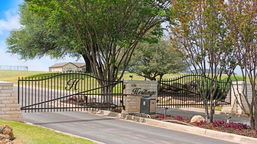 This property features a stately black wrought ir