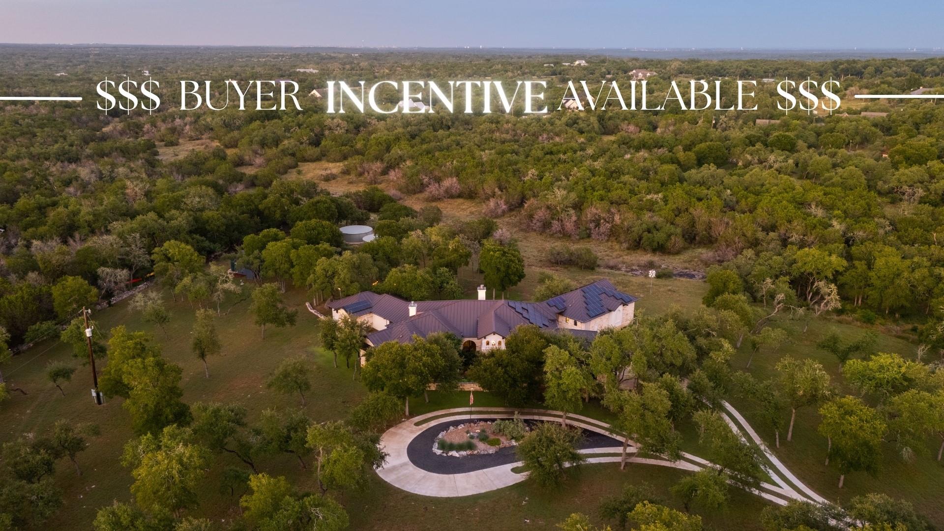A spacious estate sits nestled among mature trees