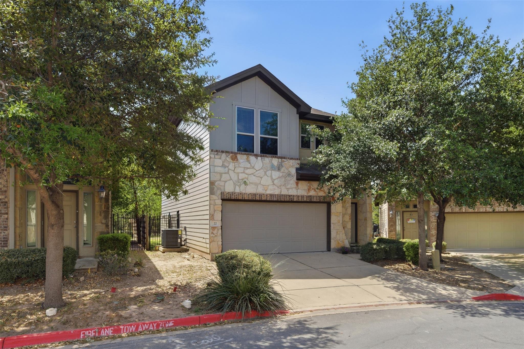 View of front of property featuring stone siding,