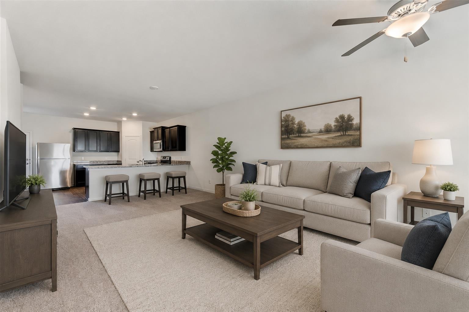 Open-concept living area featuring a kitchen with