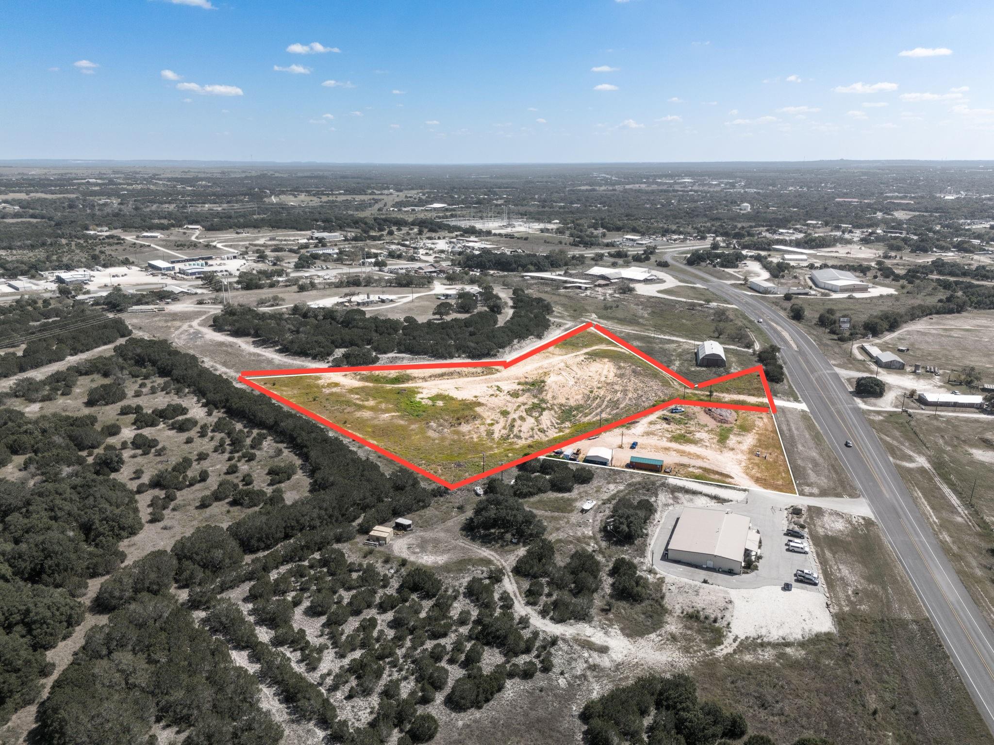Aerial view of property and surrounding area with