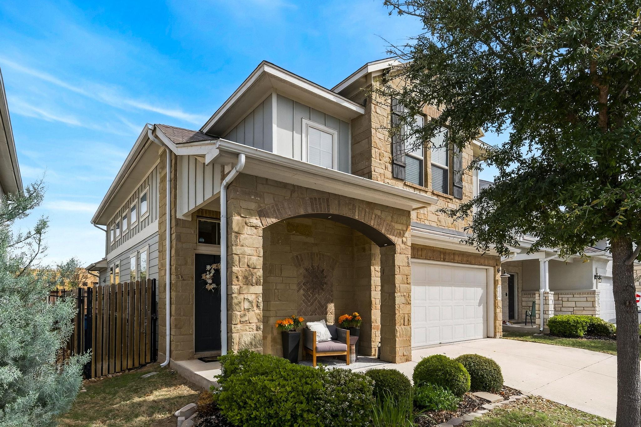 View of front of house featuring stone siding, bo
