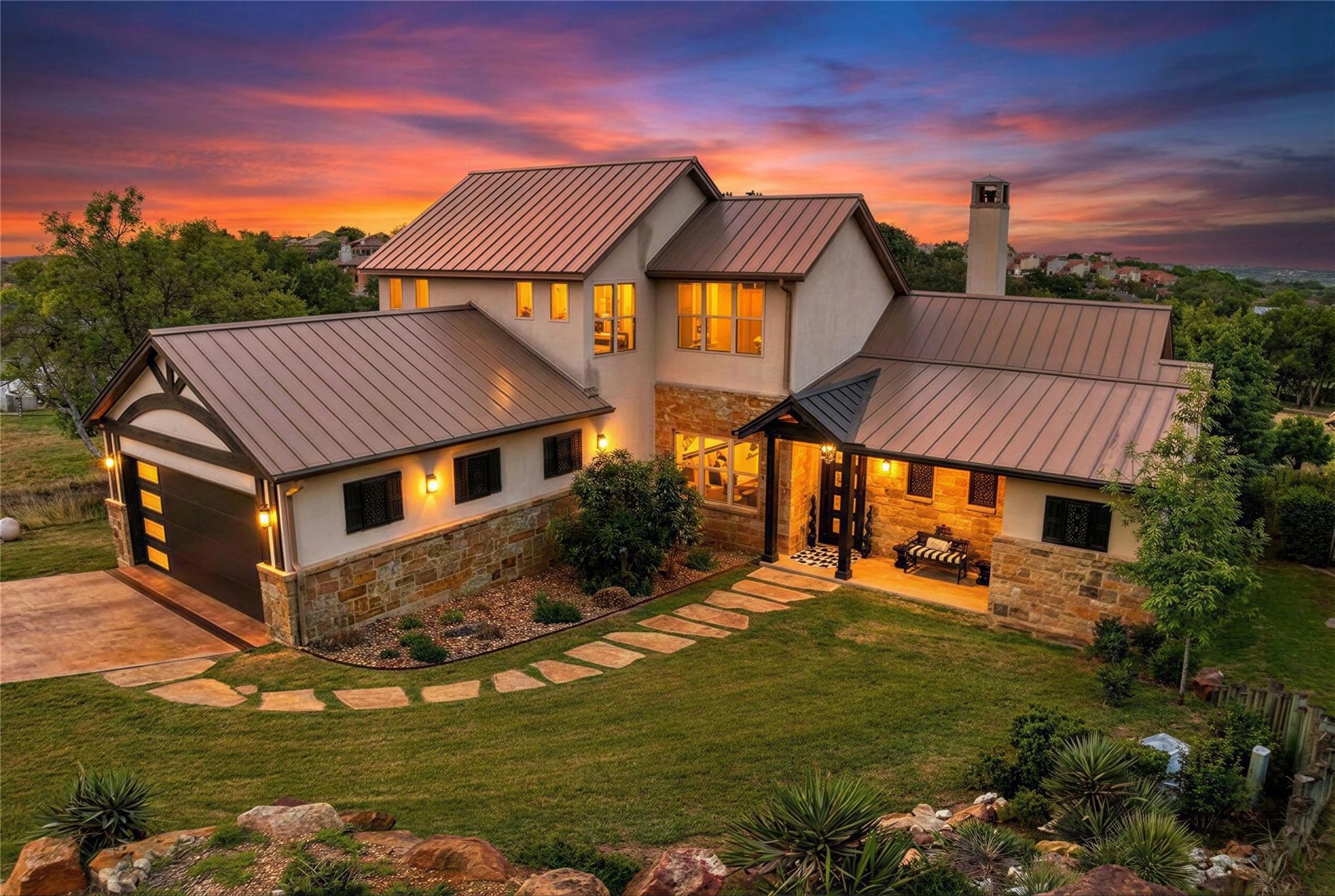 View of front of property featuring stone siding,