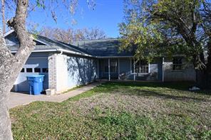 Single-story residence featuring a front lawn, at