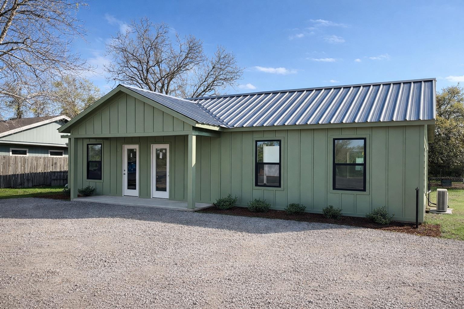 View of front facade with board and batten siding