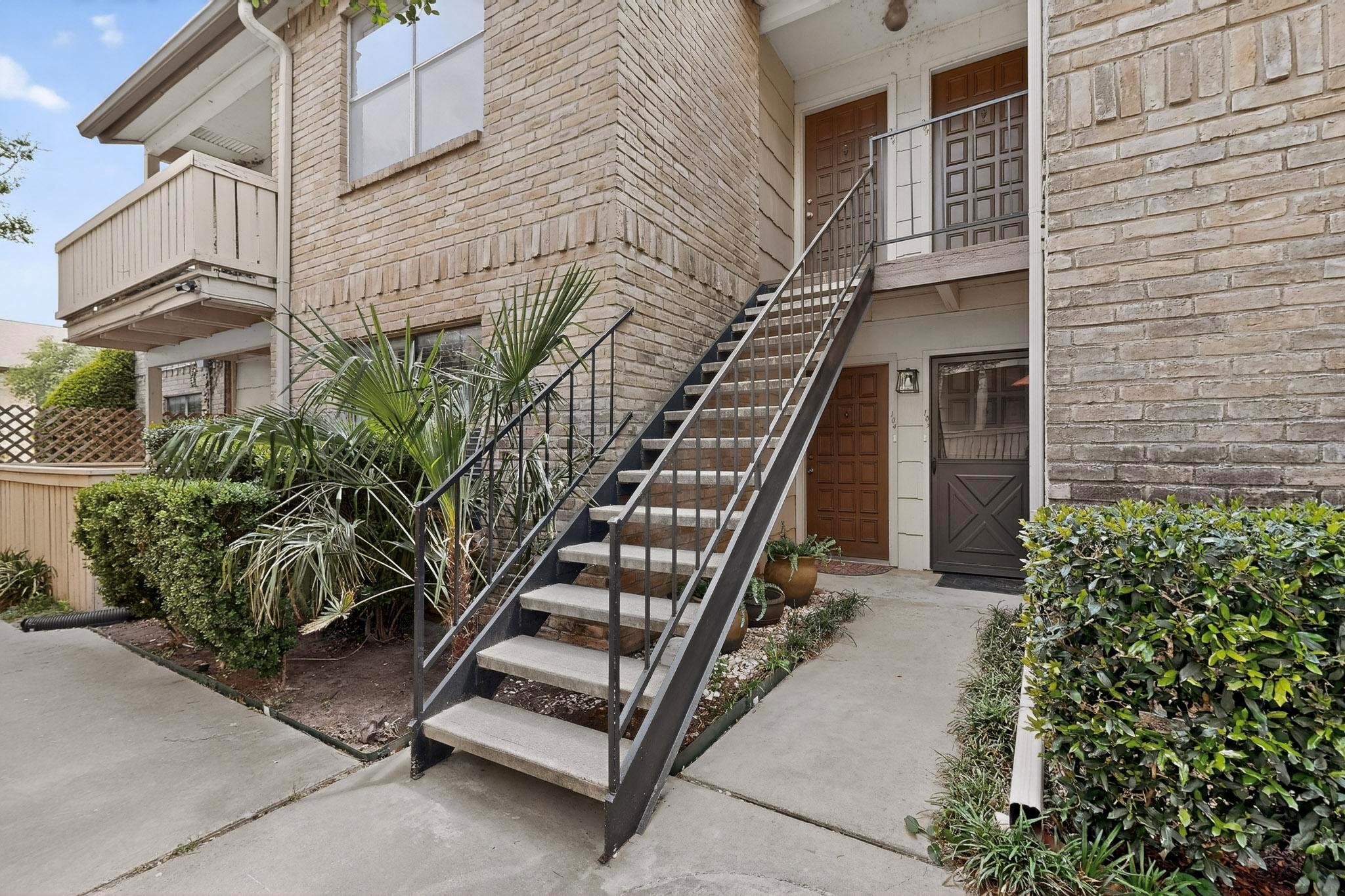 View of exterior entry with brick siding