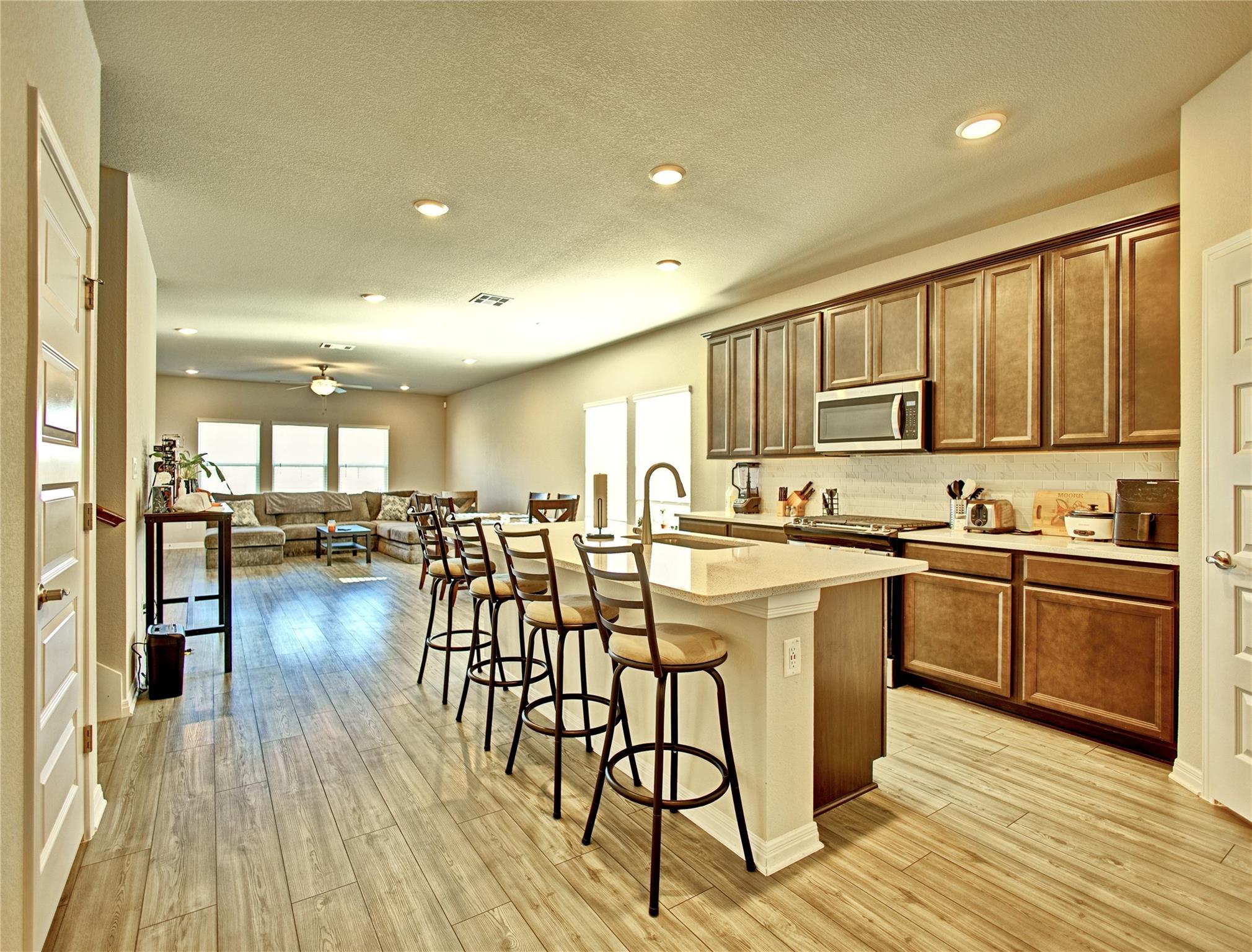 An open-concept living space integrates a well-ap