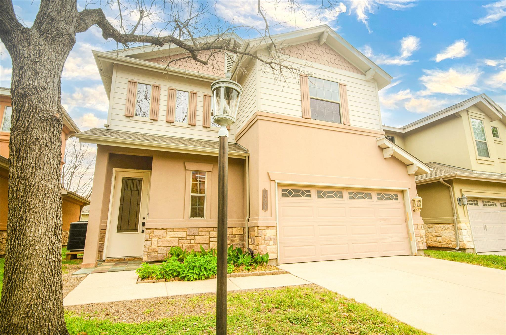 View of front of home with an attached garage, dr