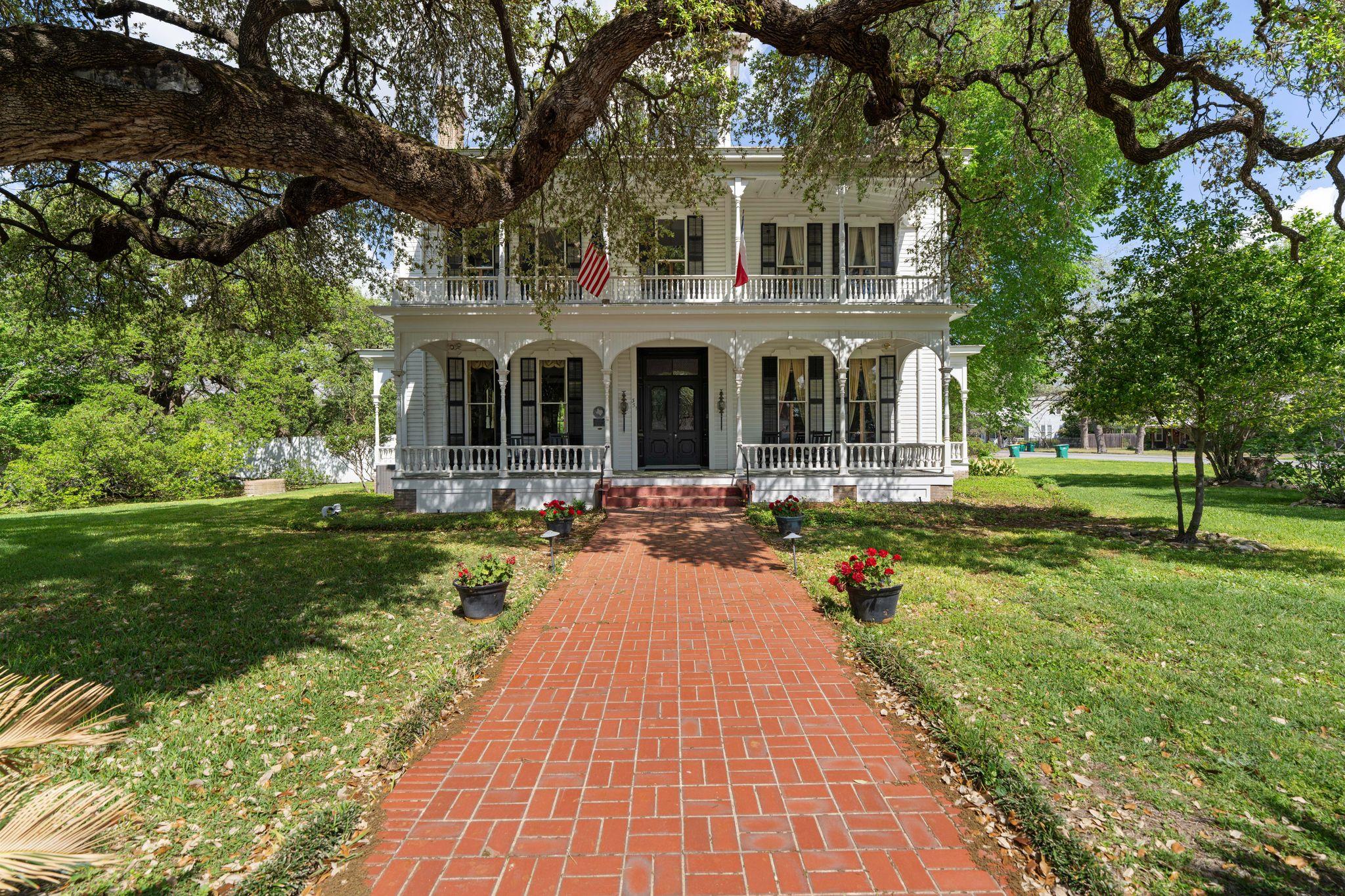 This elegant property features a white exterior w