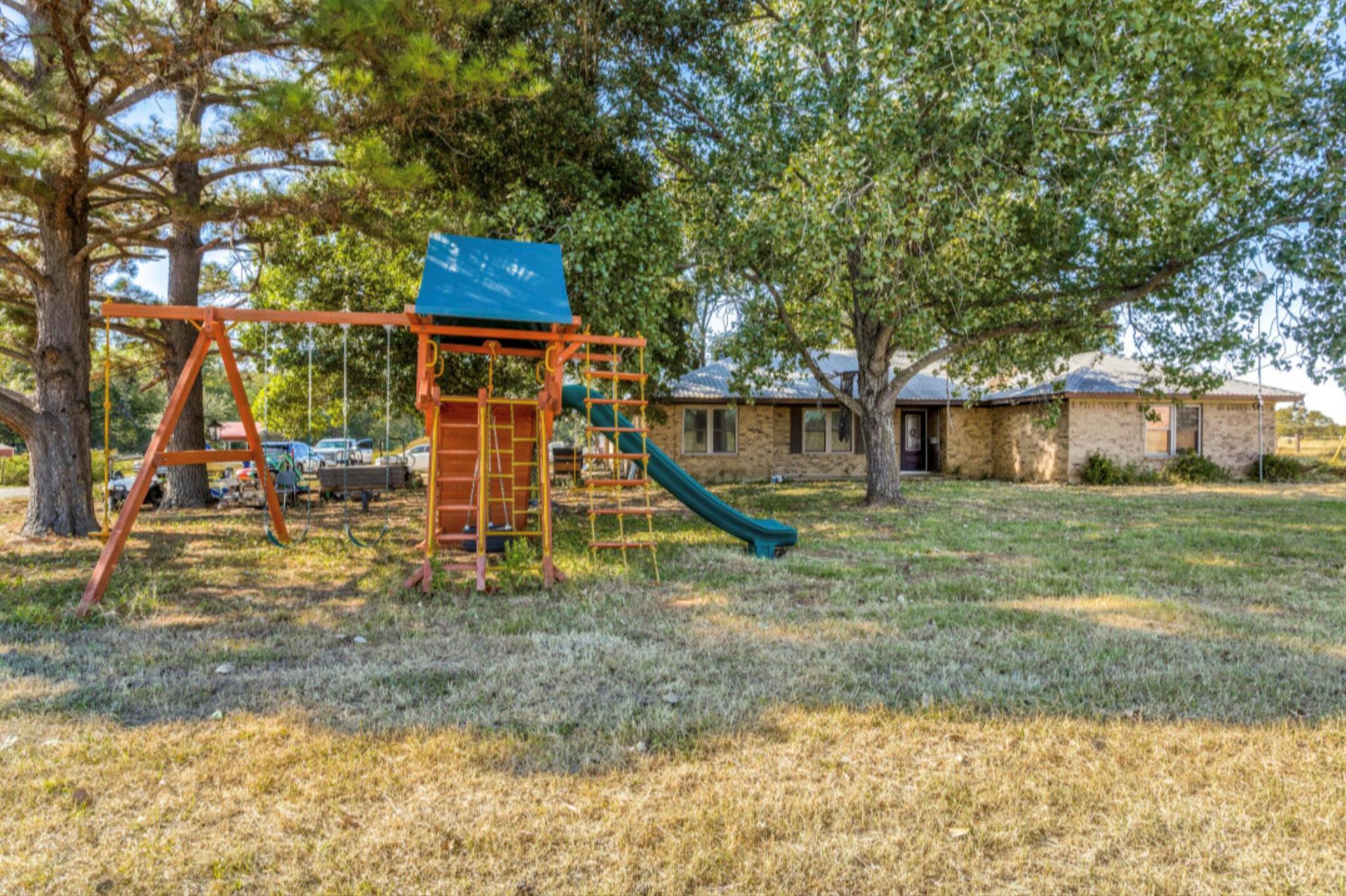 View of playground with a yard