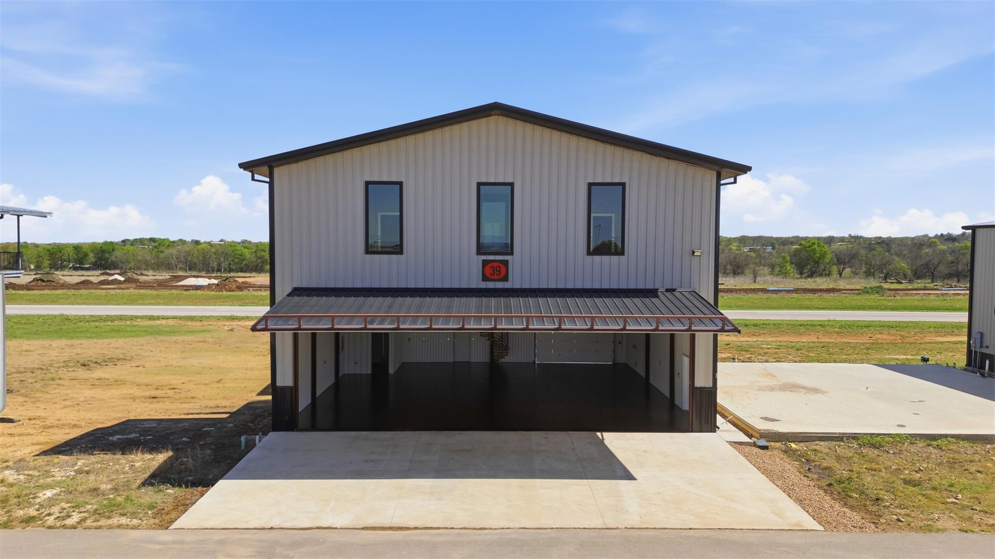 View of outbuilding featuring a carport