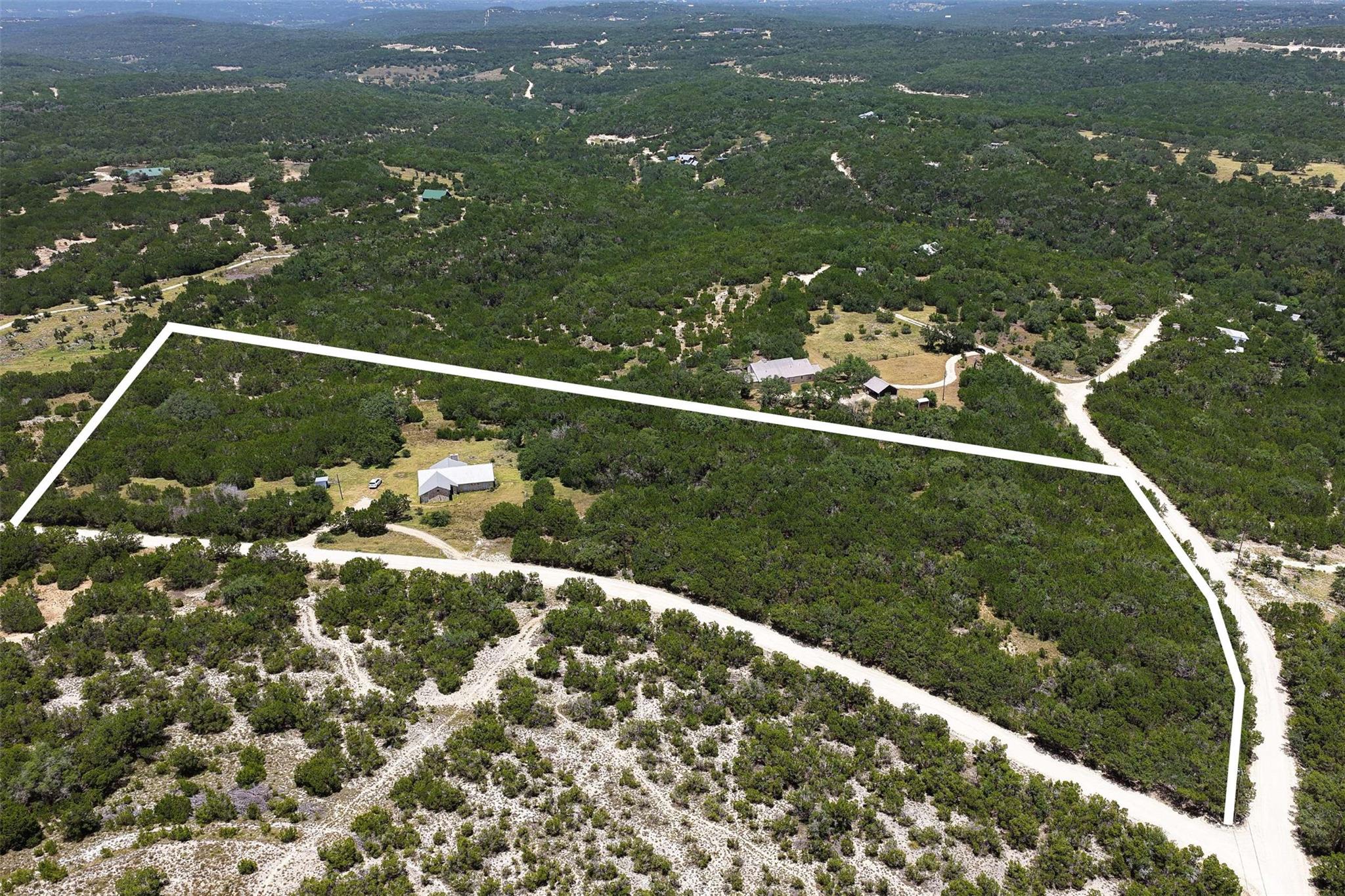 An aerial perspective reveals a vast, tree-filled