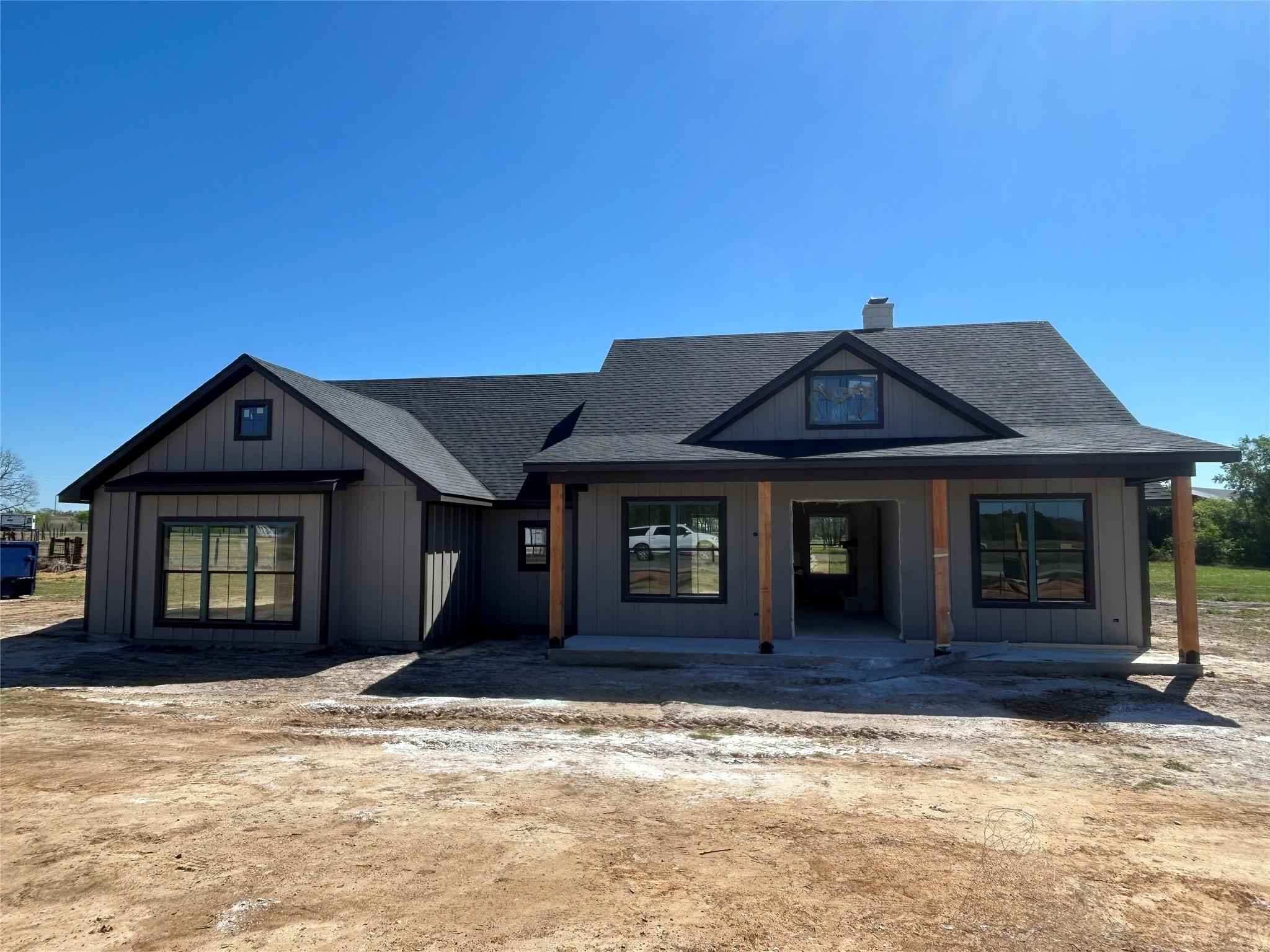 Modern inspired farmhouse with covered porch, a c