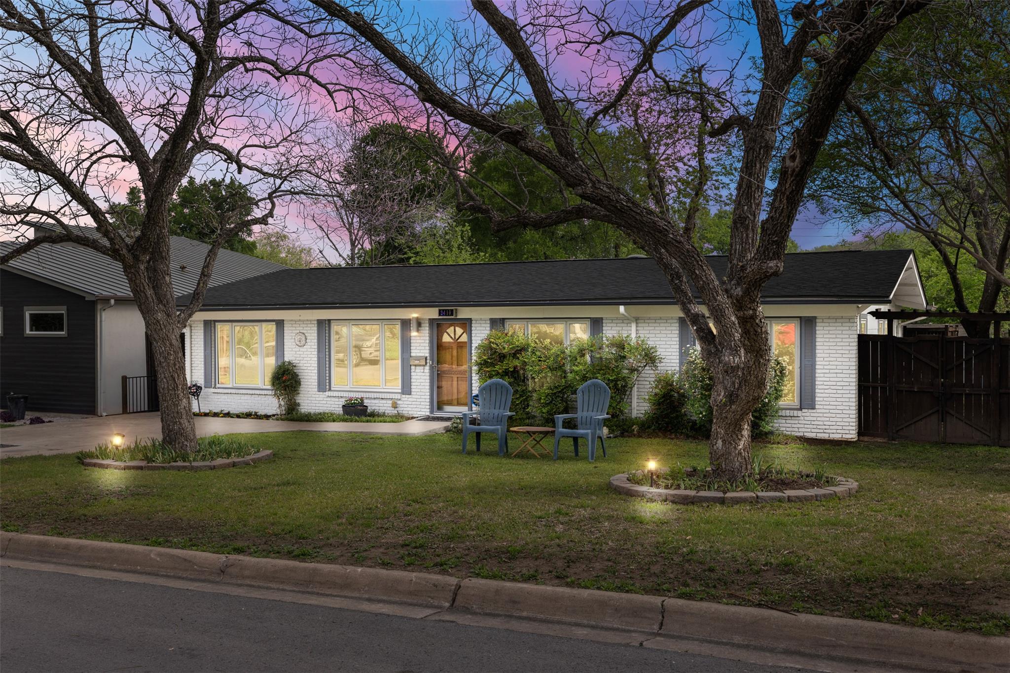 Single story home featuring brick siding and a fr