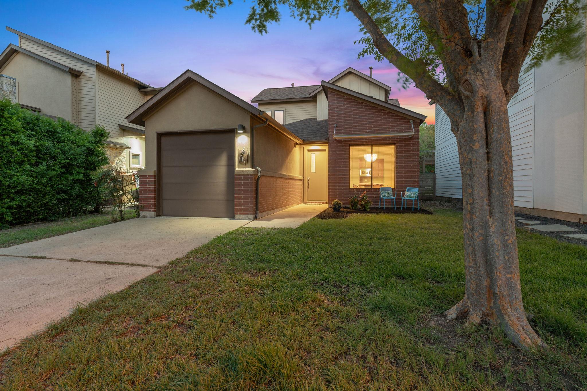 Traditional-style home featuring brick siding, a 