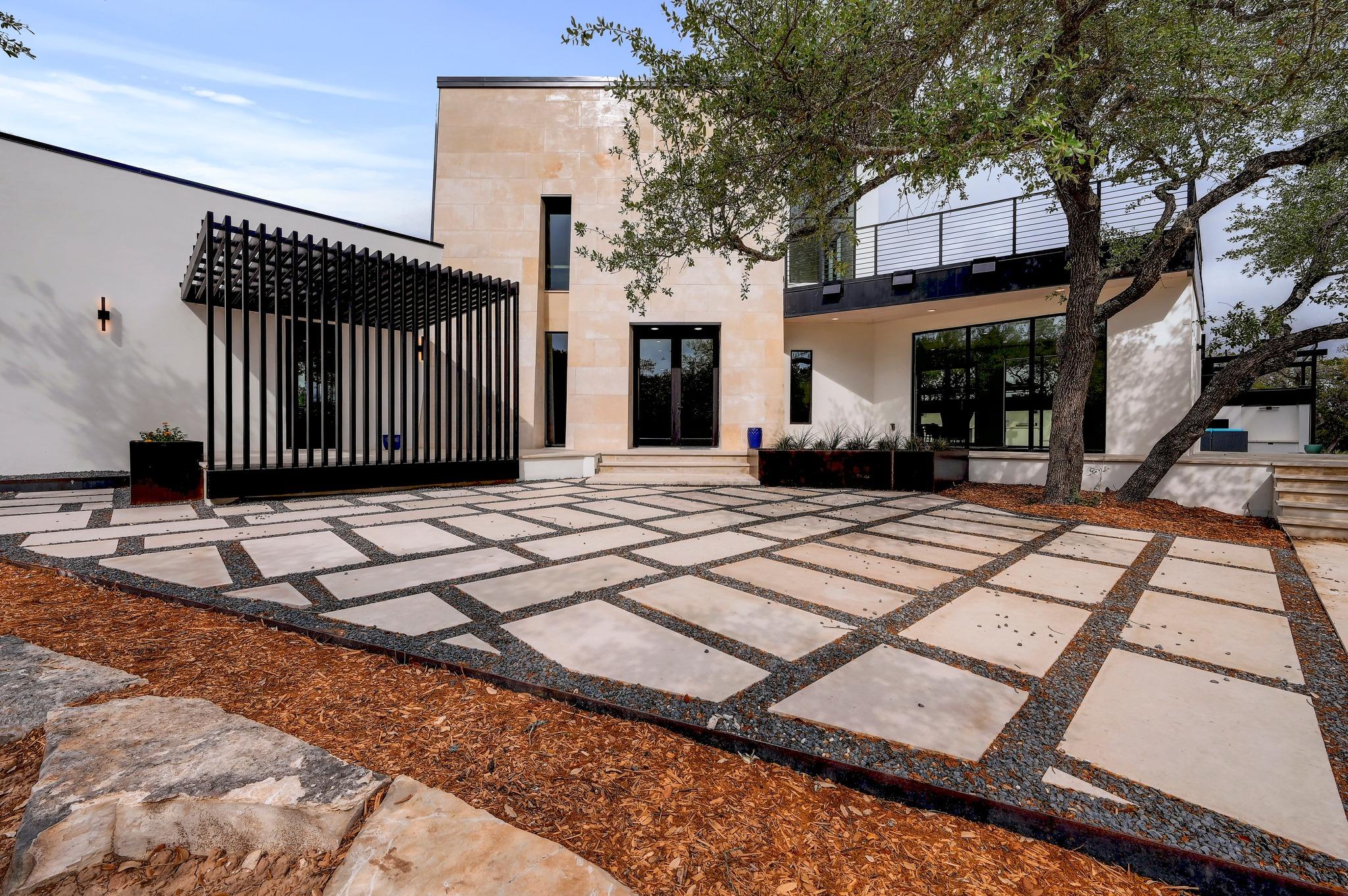 Rear view of property with a patio, stucco siding