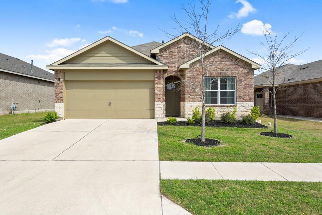 View of front of property featuring brick siding,