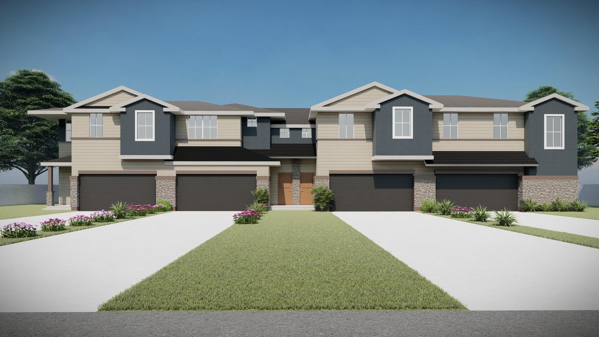View of front of property with driveway, an attac