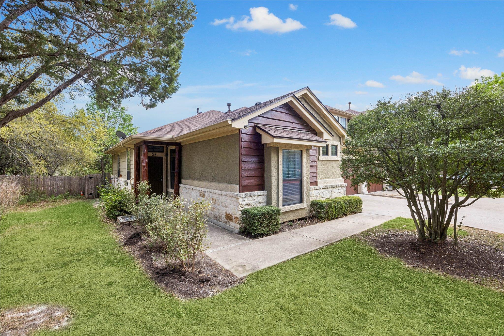 View of front of house featuring stone siding