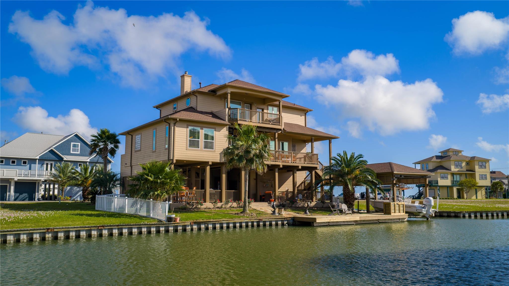 Back of house featuring a balcony, a patio area, 