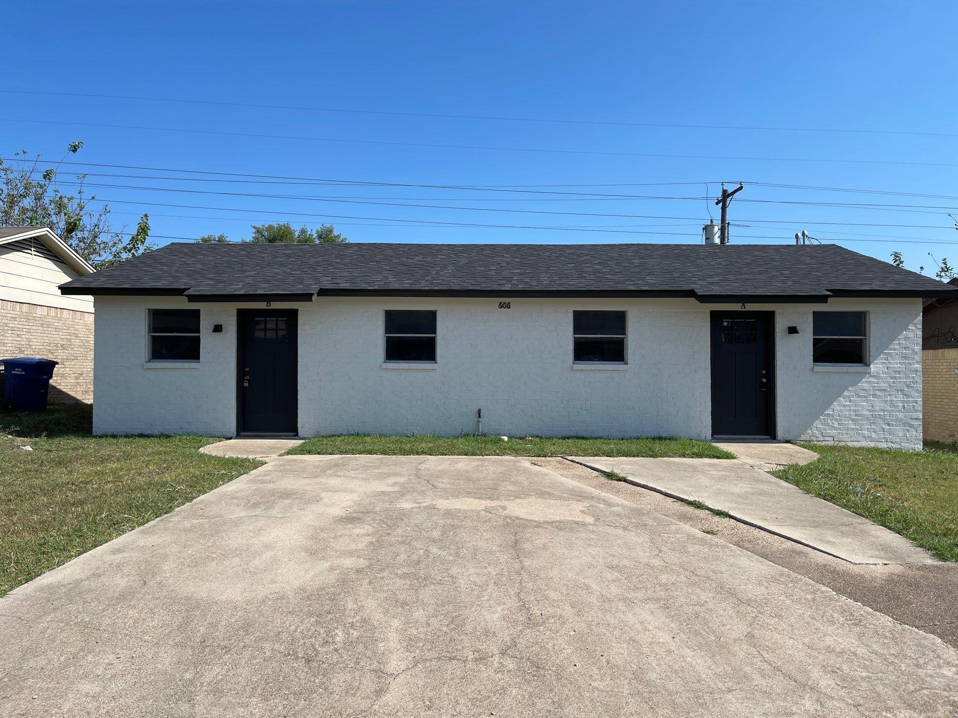 Single story home with a front lawn, a shingled r