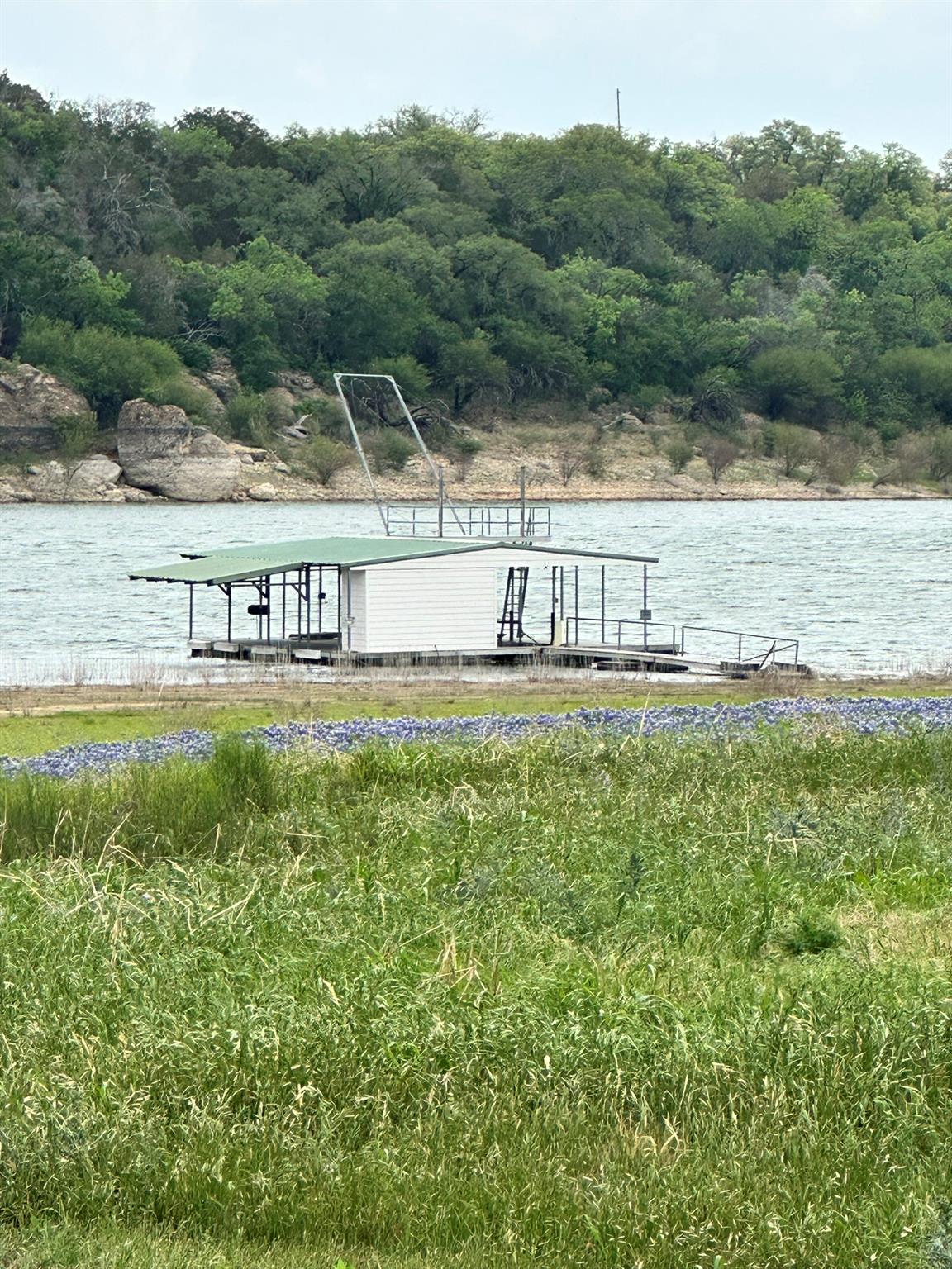 Dock featuring a water view and a wooded view