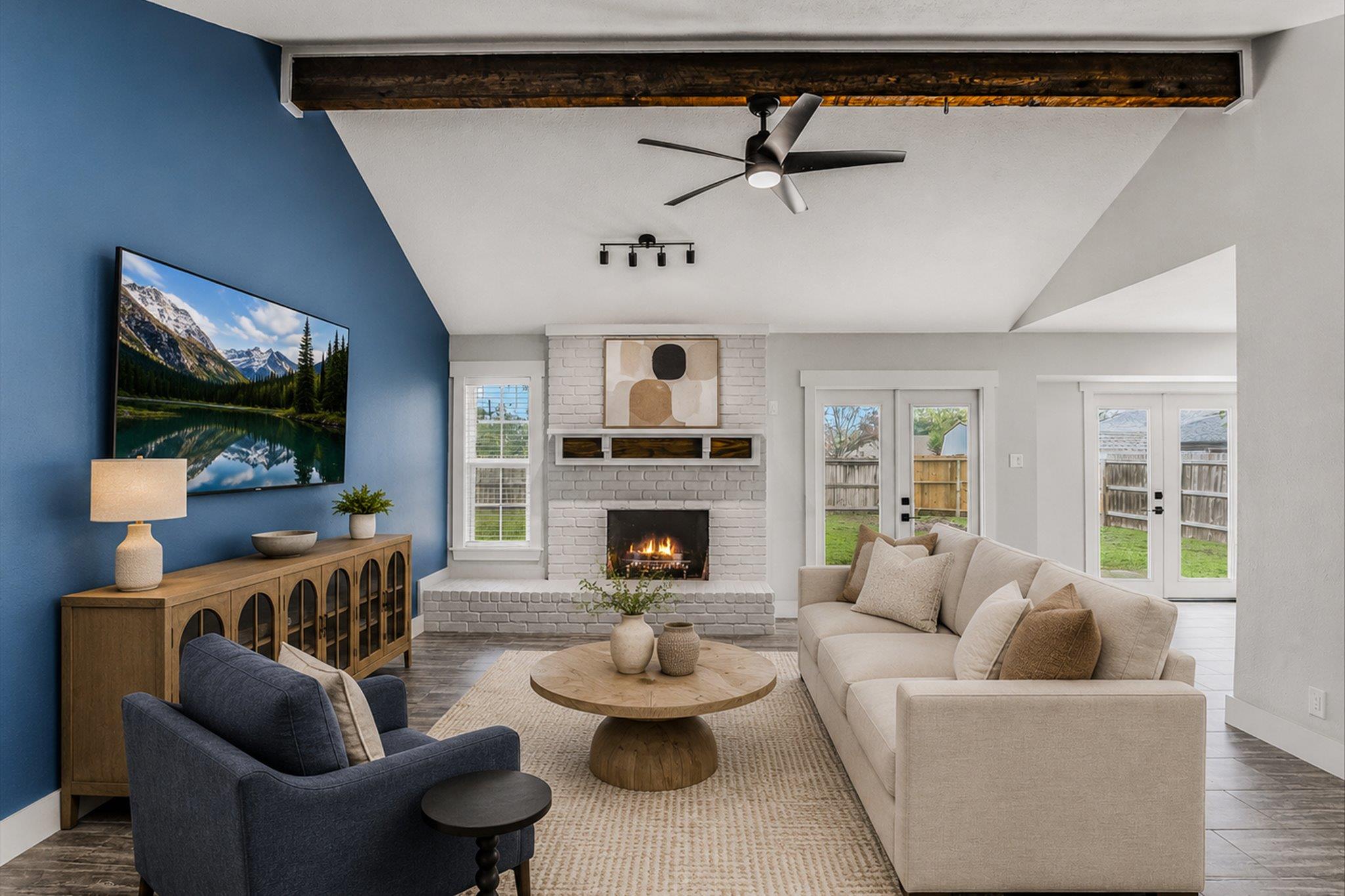 A vaulted ceiling with an exposed wood beam highl
