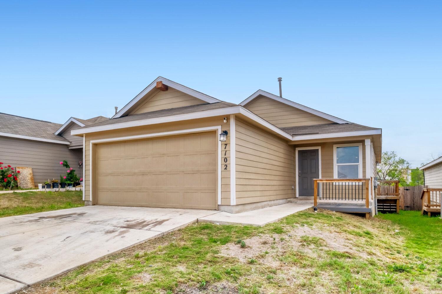 View of front of house with an attached garage, d