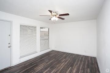 Empty room featuring dark wood-style flooring and