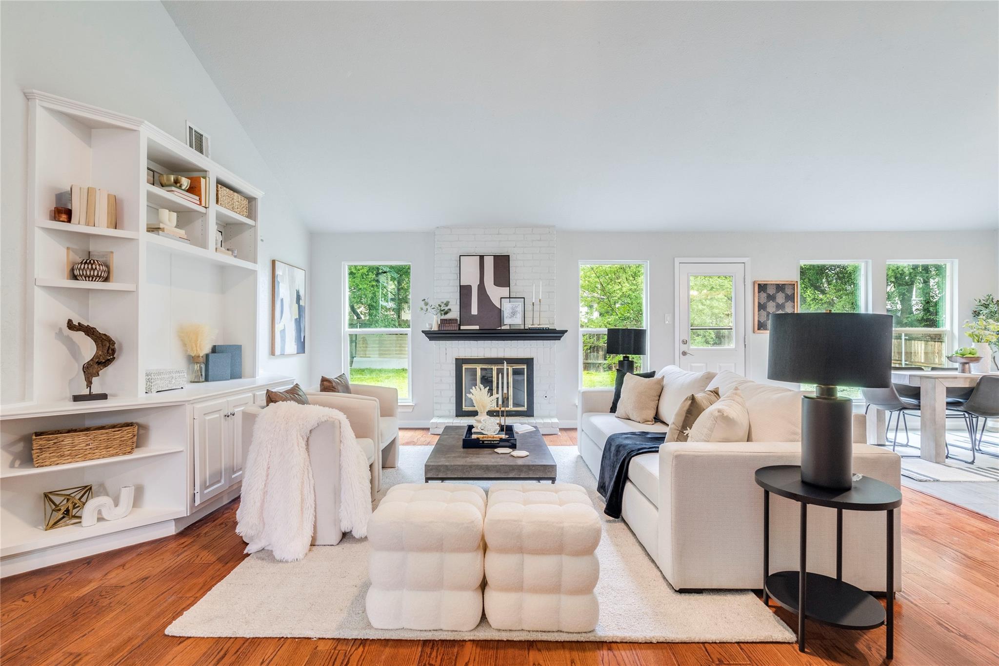 A welcoming living area showcases built-in shelvi
