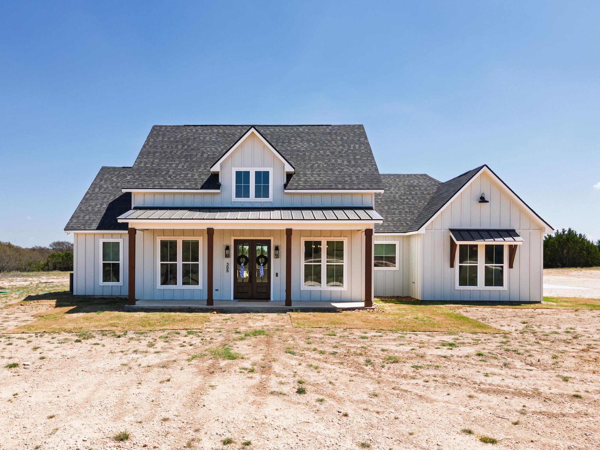 View of front of property featuring board and bat