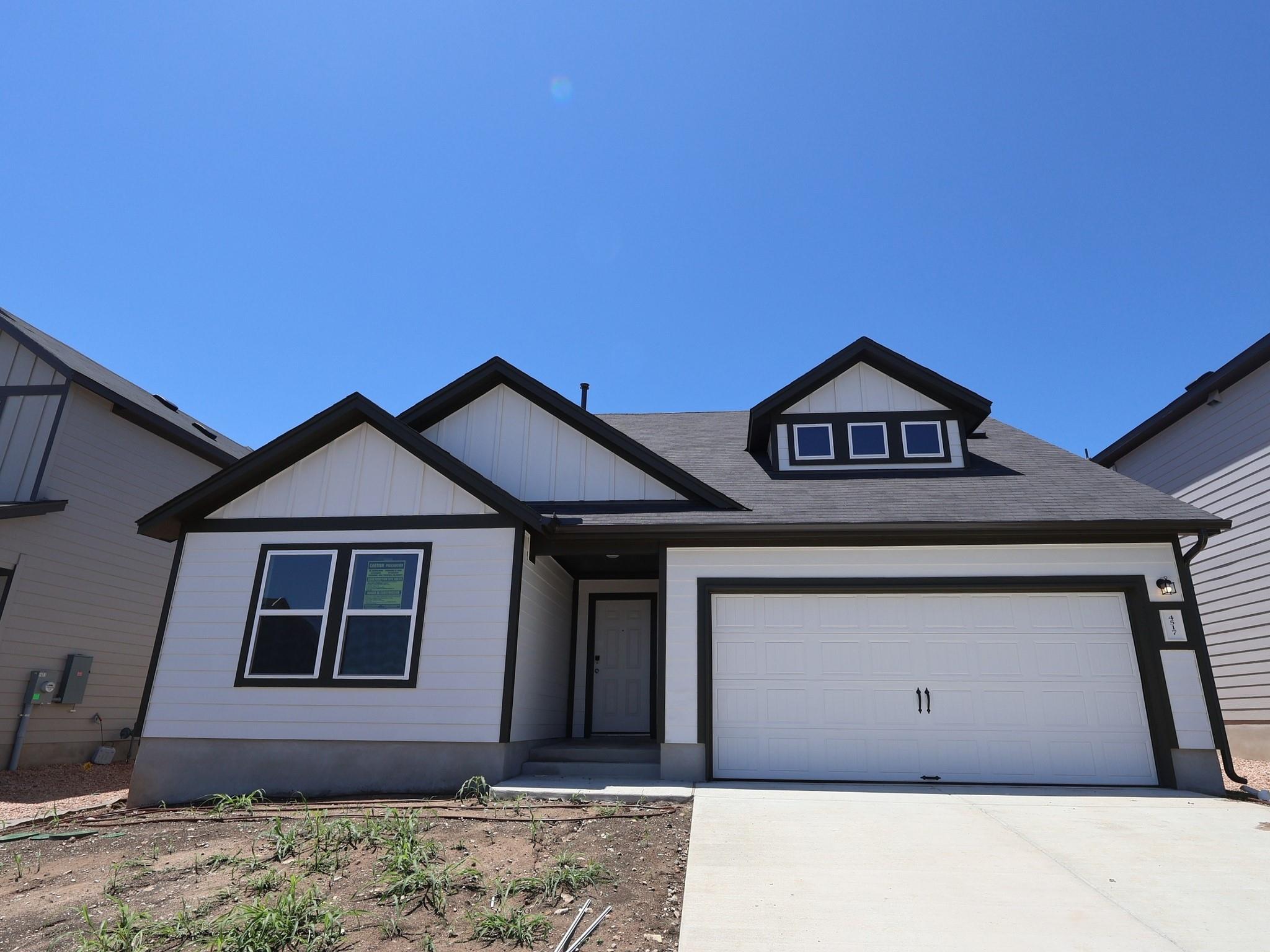 A newly built residence with sharp lines and a cr