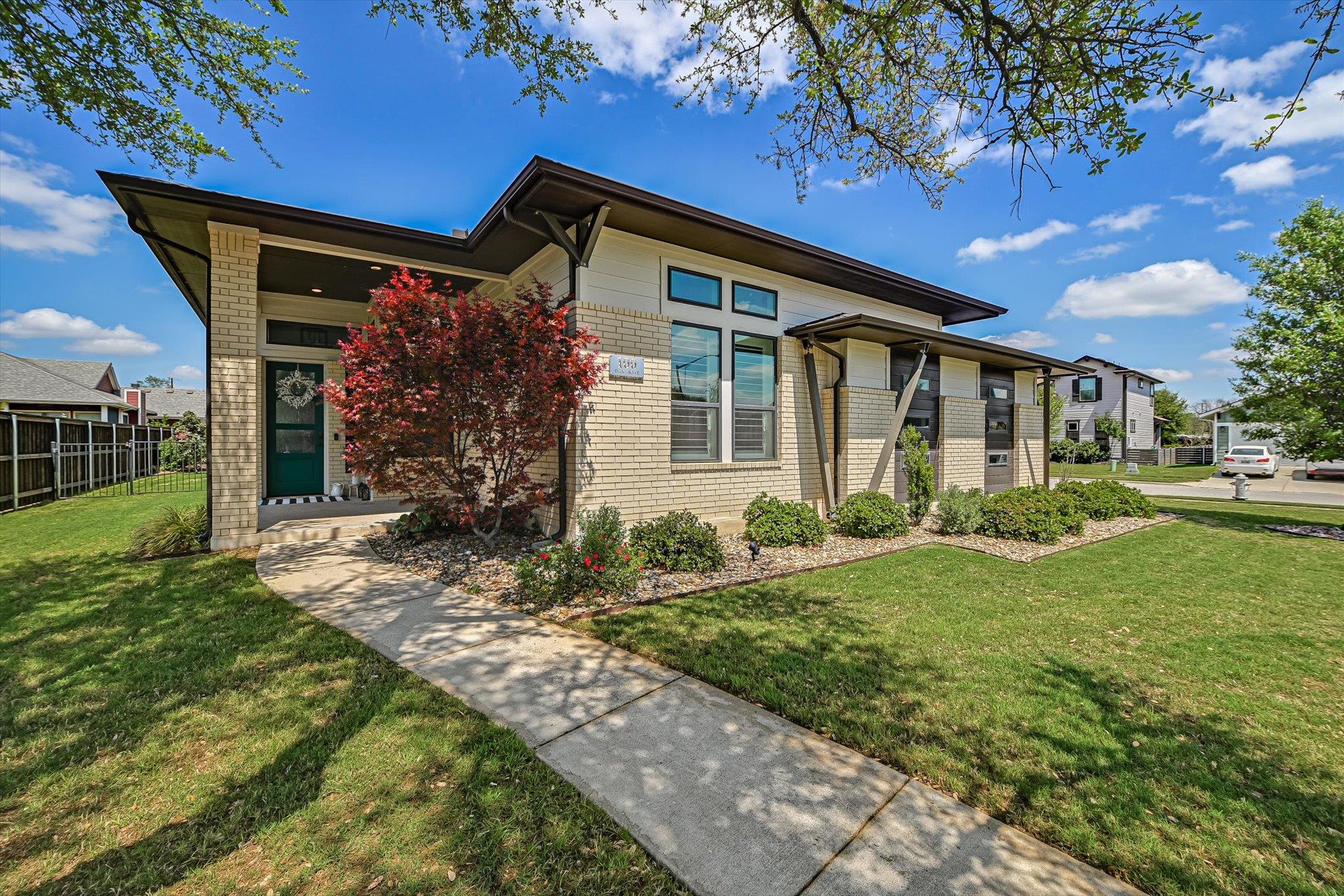 Prairie-style home featuring brick siding