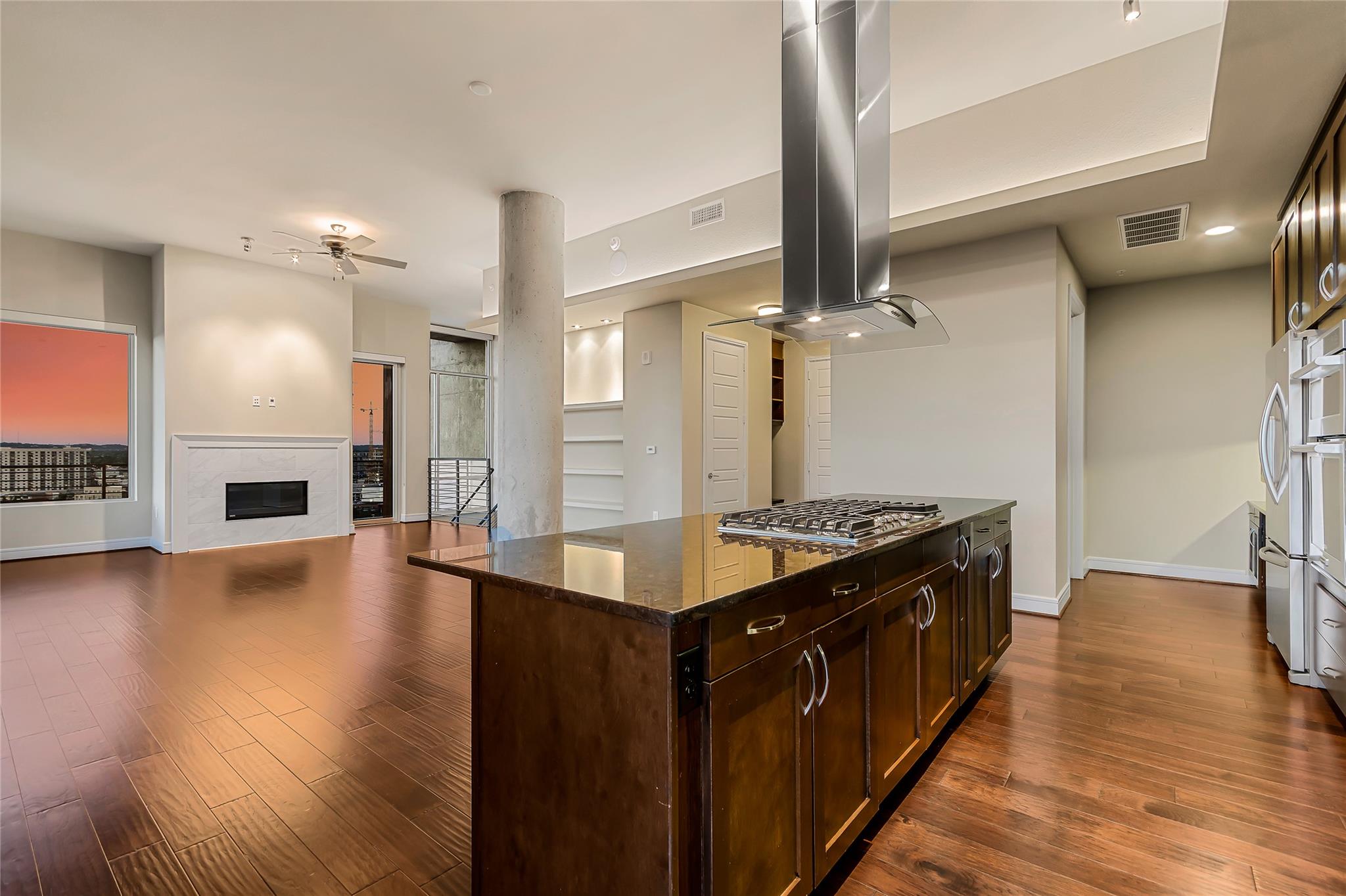 Gleaming hardwood floors flow throughout this ope