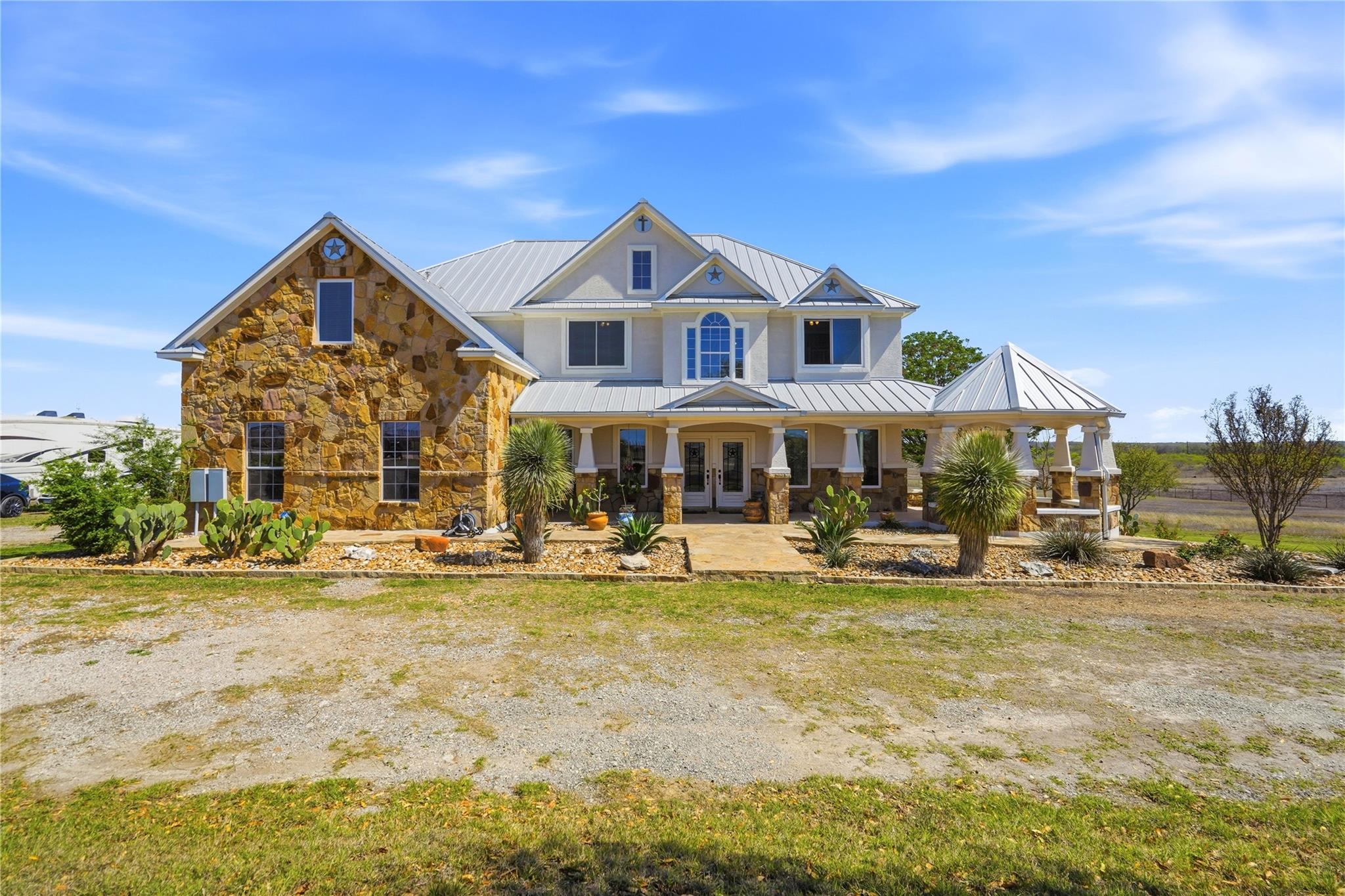 Craftsman-style house featuring a porch, a metal 