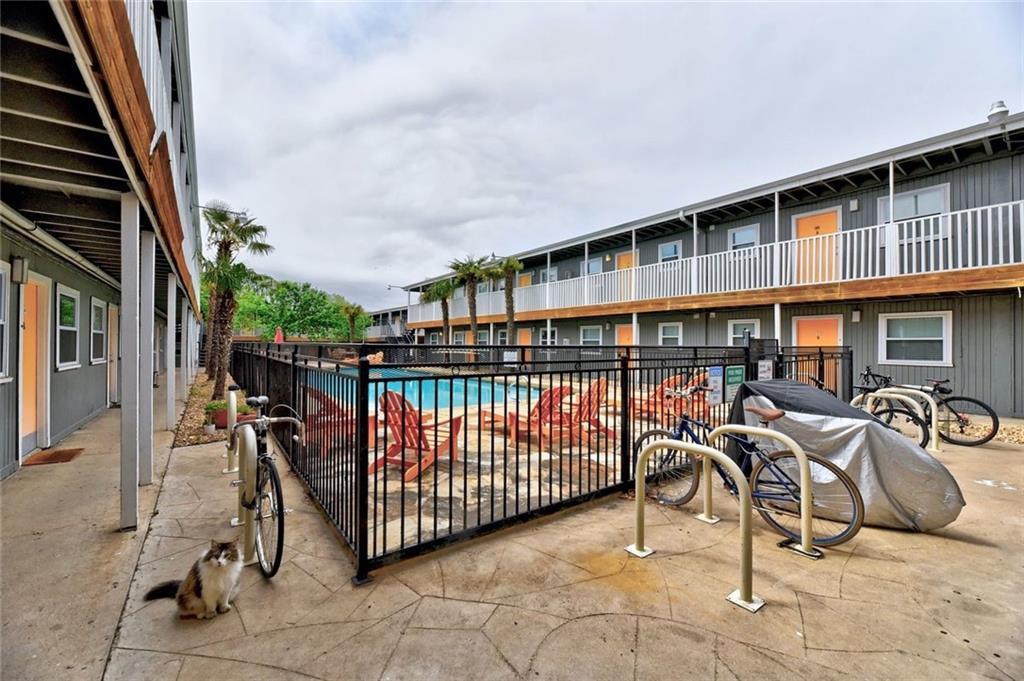 Community pool with a patio