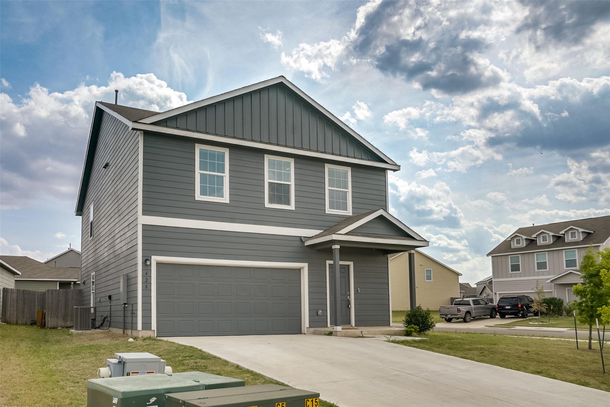View of front facade with board and batten siding