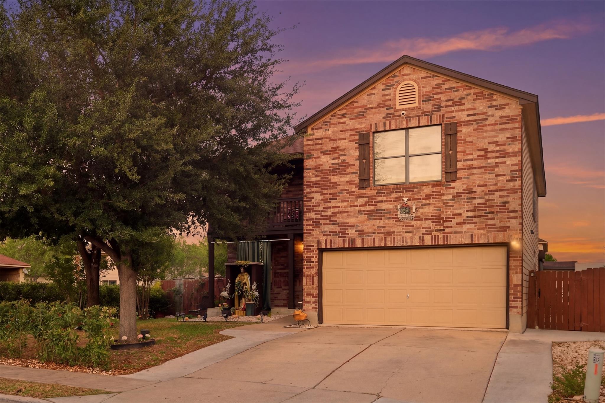 View of front of property with a balcony, an atta