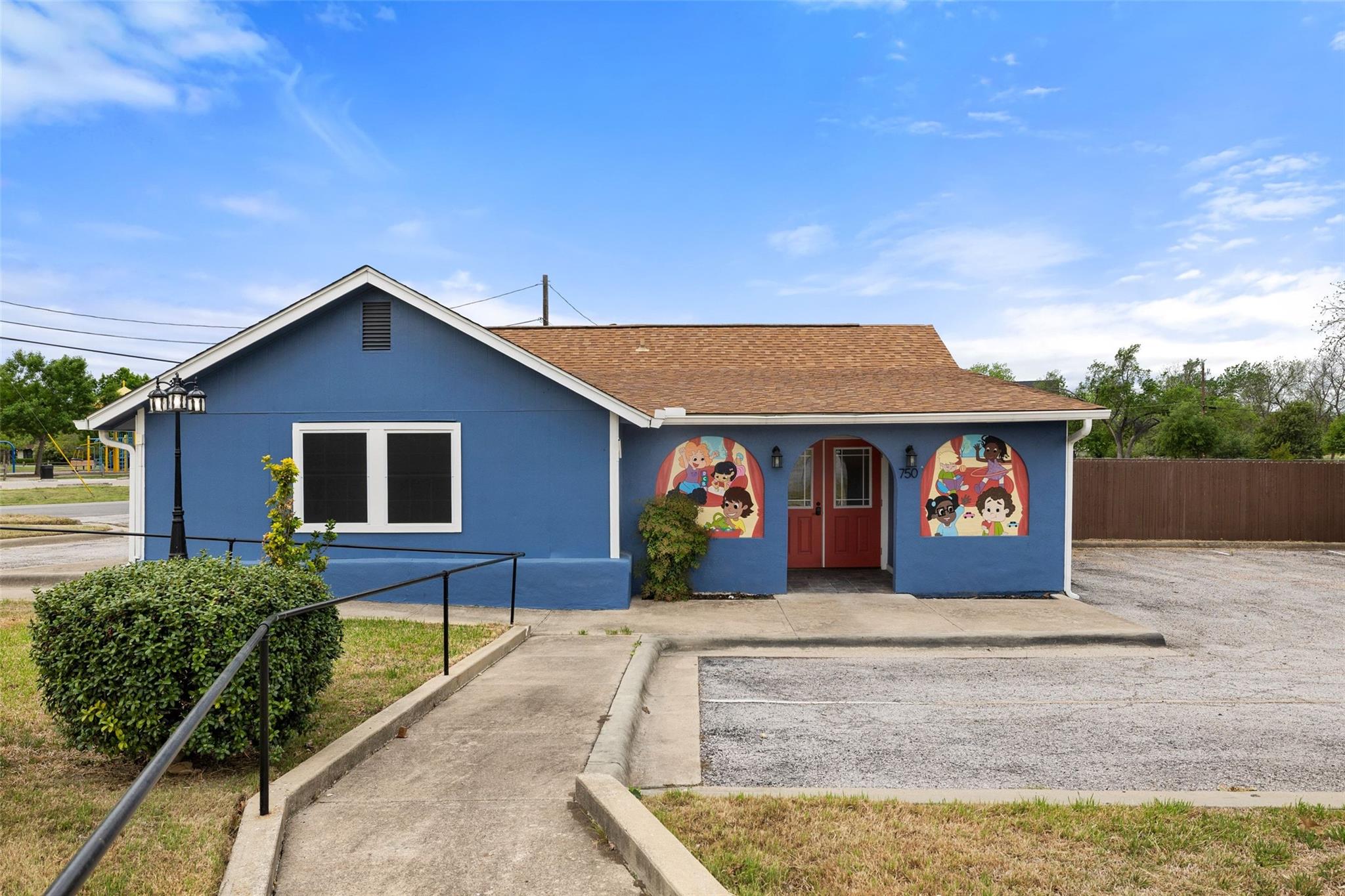 View of front of home featuring stucco siding and
