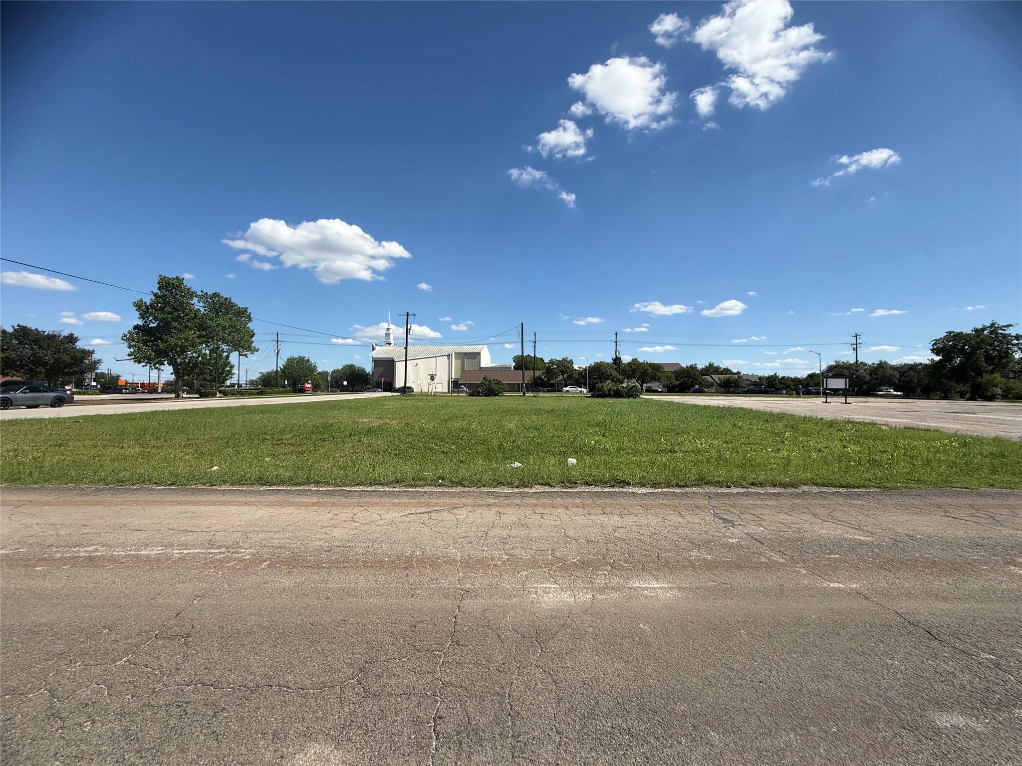 Expansive grass lot featuring a flat topography a