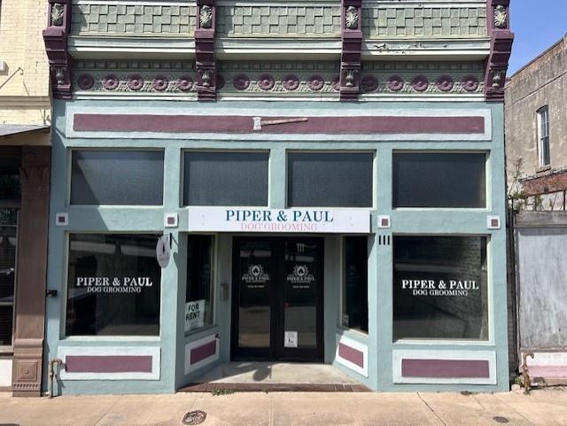 View of exterior entry featuring french doors