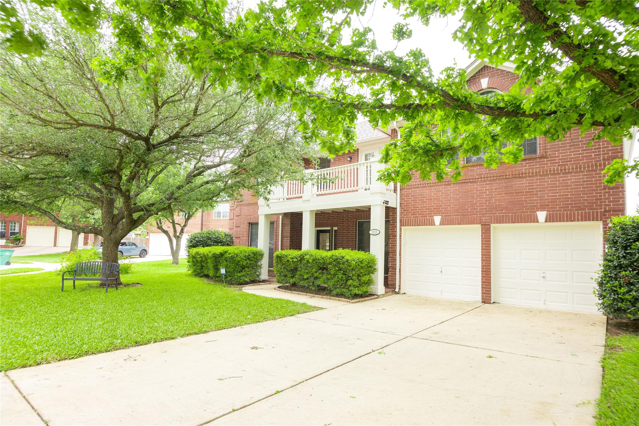 The property features a brick exterior, a two-car