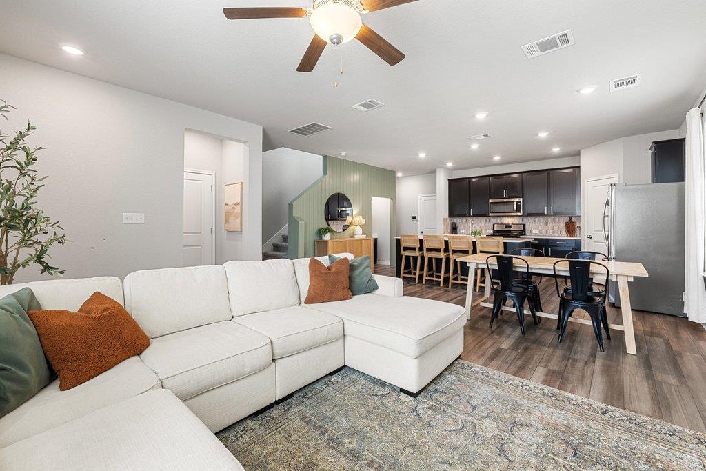 Expansive open-concept living area featuring wood