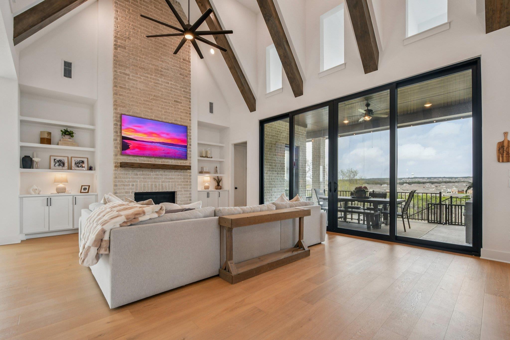 This living area features a vaulted ceiling with 