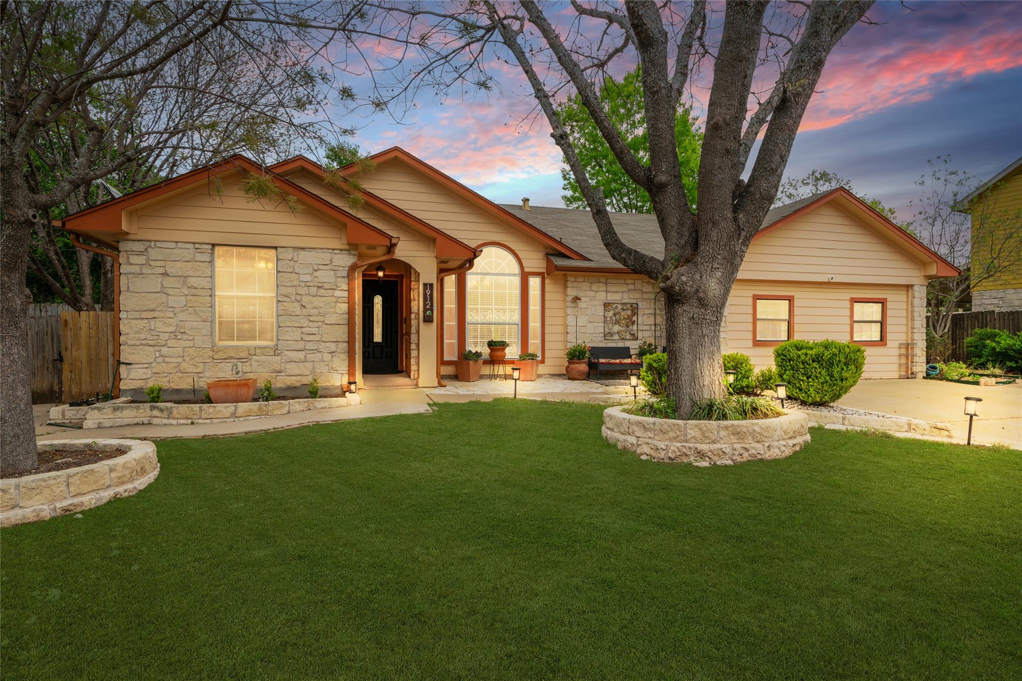 View of front facade featuring stone siding
