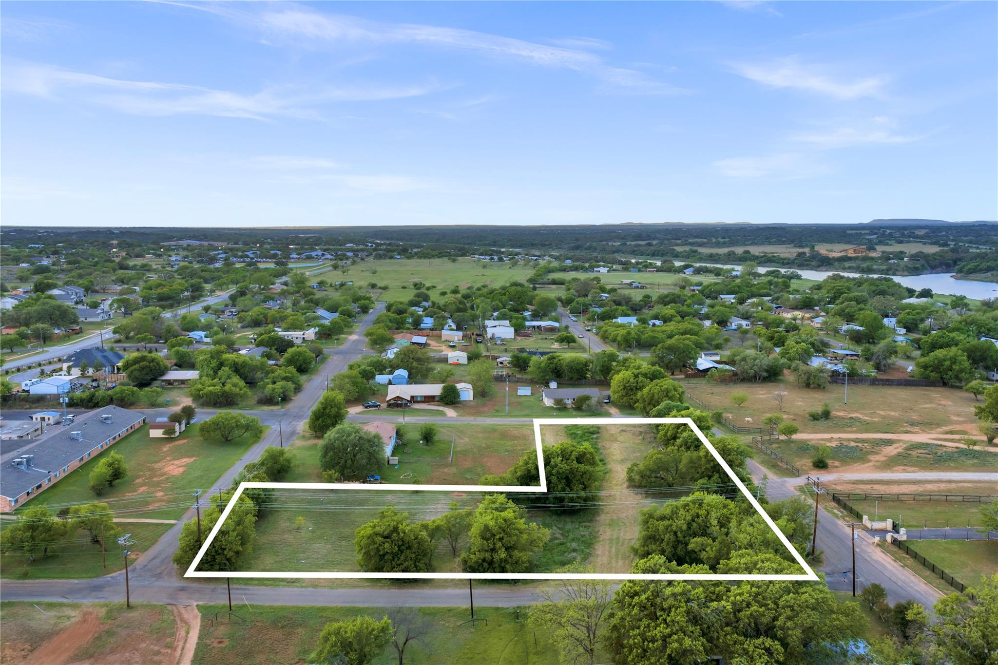 Expansive parcel with mature trees and direct roa