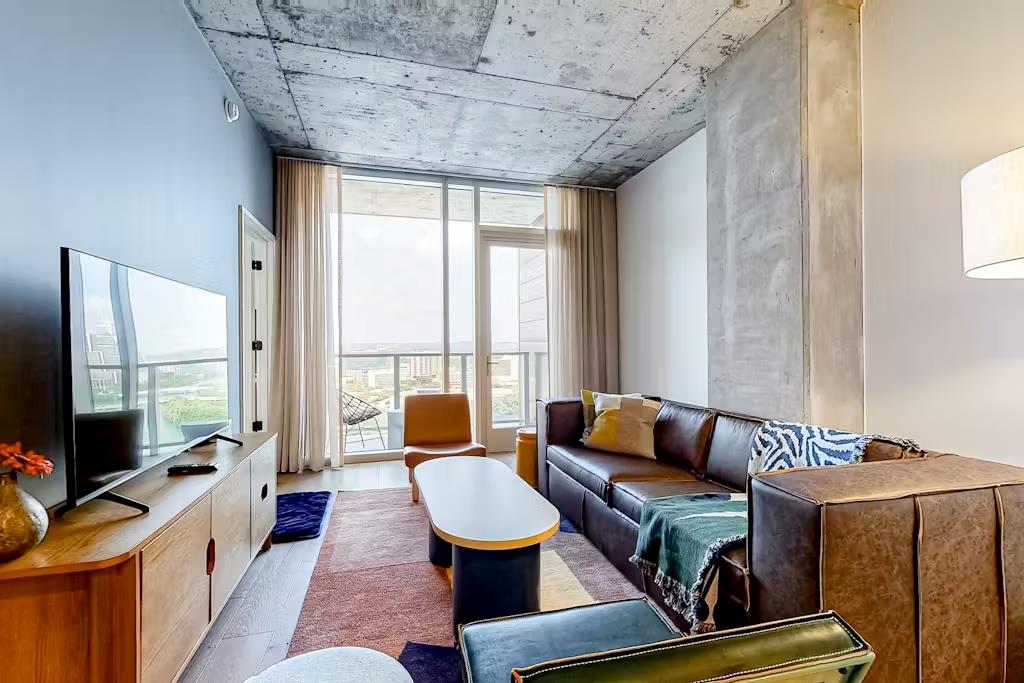 Living room with light wood-style floors and expa